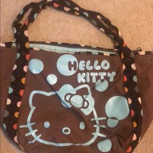 Brown Hello Kitty canvas hobo bag.